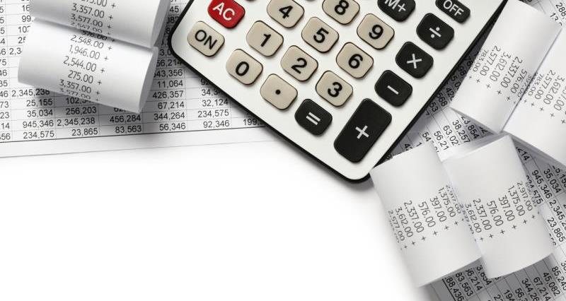 A calculator and receipts