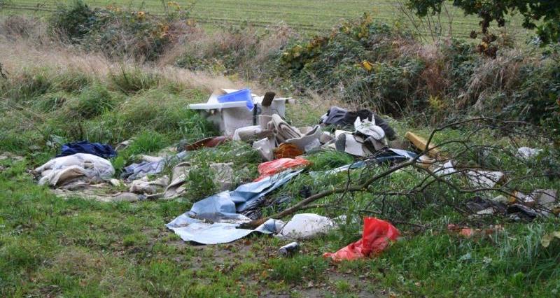 A picture of household items dumped in a field