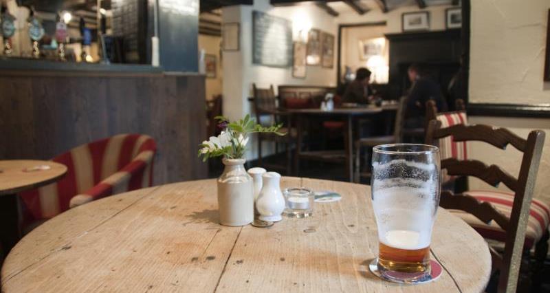 An image of an unoccupied table in a pub
