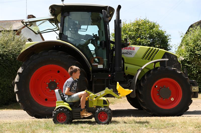 Boys riding shop tractors