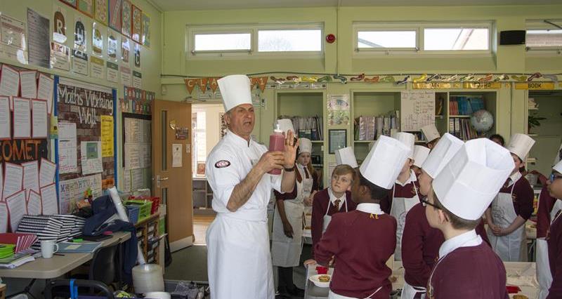 Schoolchildren with a chef