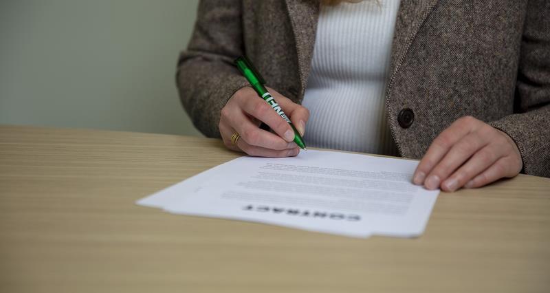 An image of a solicitor looking over a contract