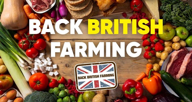 A table full of British produce with the text: "Back British Farming" and the Back British Farming logo.