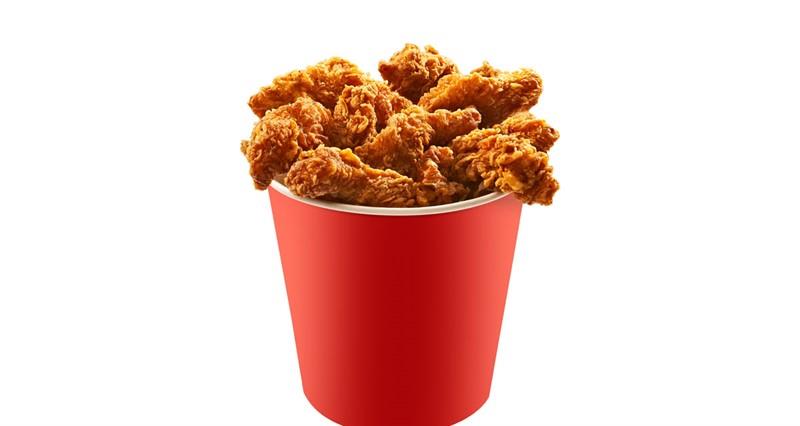 Red bucket of fried chicken on white background