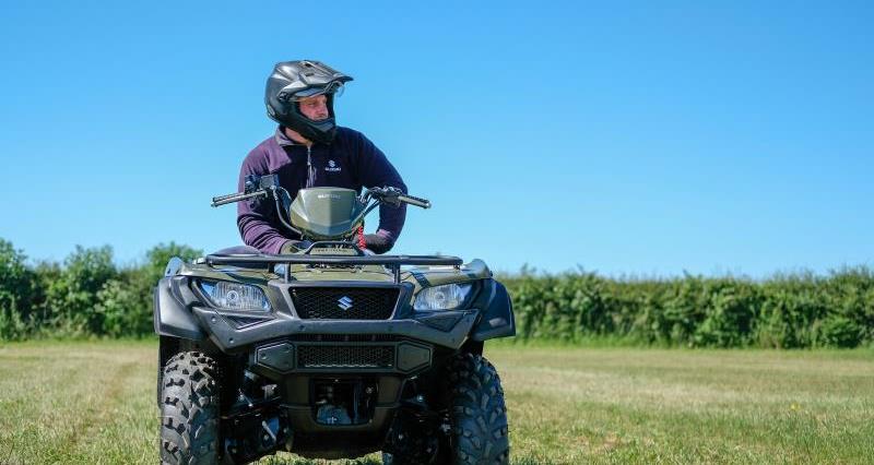 An image of a quad bike and rider wearing a helmet