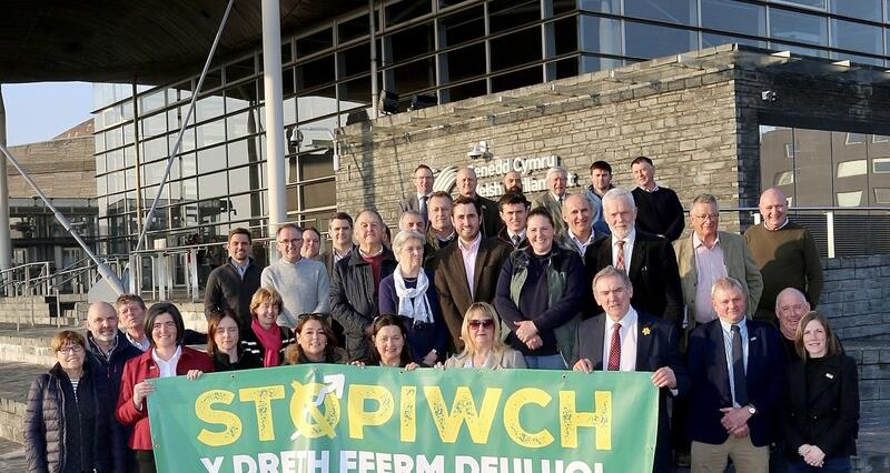 Member of NFU Cymru outside the Senedd before Plaid Cymru's IHT debate 