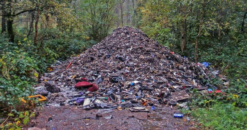 Large scale fly-tipping of rubbish blocking rural road