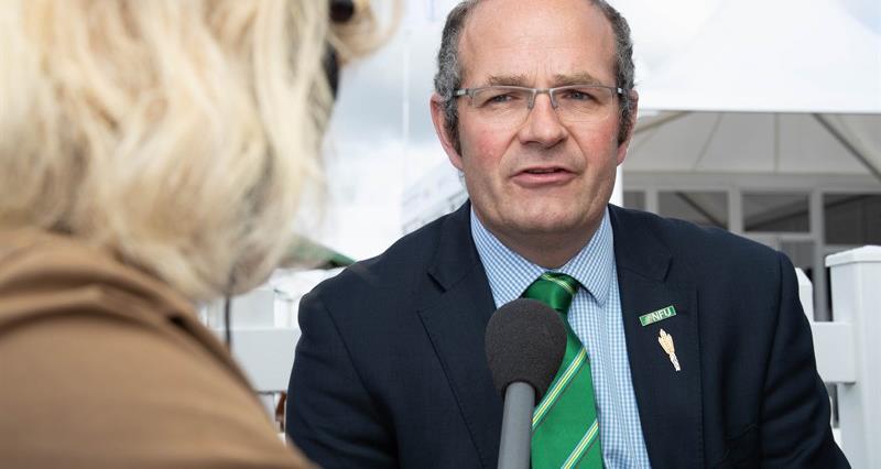 An image of NFU Deputy President Tom Bradshaw being interviewed at a press conference at Cereals 2022