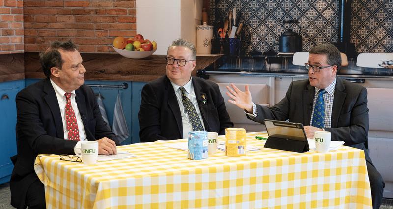 José Orive, Michael Sly and James Northen sat in a kitchen