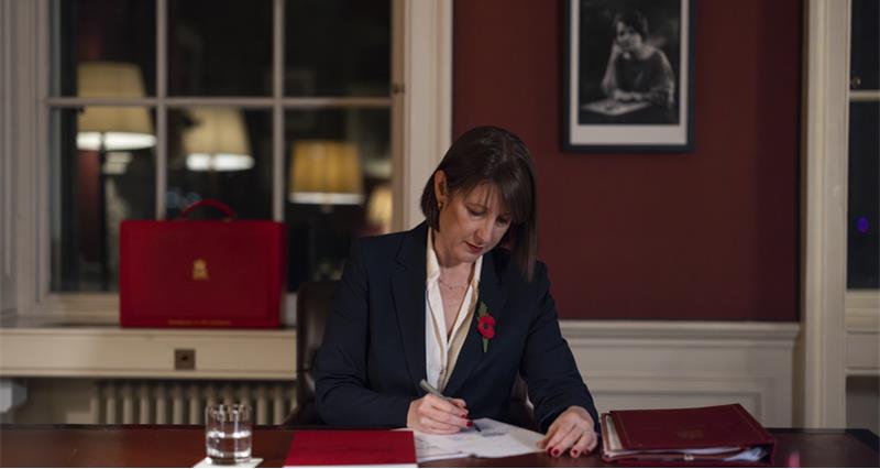 Rachel Reeves writing at her desk