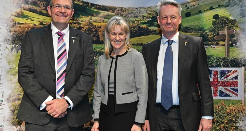 An image of the new officeholder team stood in front of a farming banner. Left to right: NFU Deputy President Tom Bradshaw, NFU President Minette Batters, NFU Vice President David Exwood