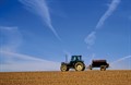 Alamy_fertiliser-blue sky-tractor-A4BGKH