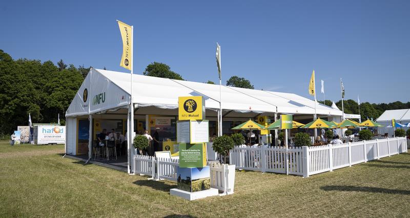 A picture of the NFU's and NFU Mutual's branded marquee during Cereals event in 2023. The picture is taken on a sunny day with blue skies.