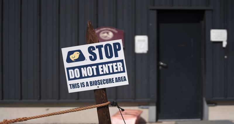 A picture of a biosecurity sign outside a farm building