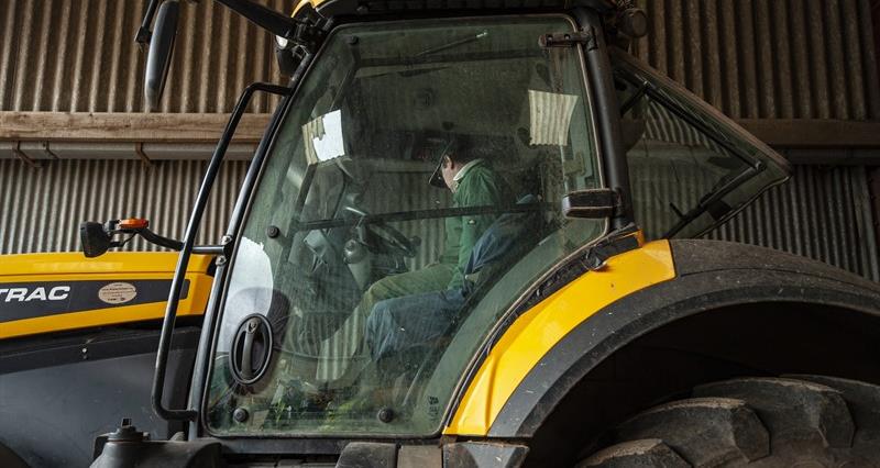 An image of JCB fast tractor inside a shed