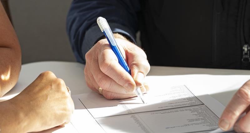 Two people going through a checklist