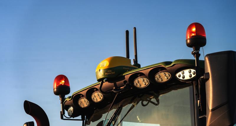 A GPS receiver on the roof of a tractor