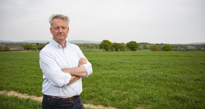NFU vice president David Exwood stood in front of a field of grass