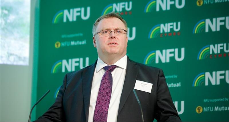 A picture of Terry Jones giving a speech at a lectern in front of an NFU branded pull up.