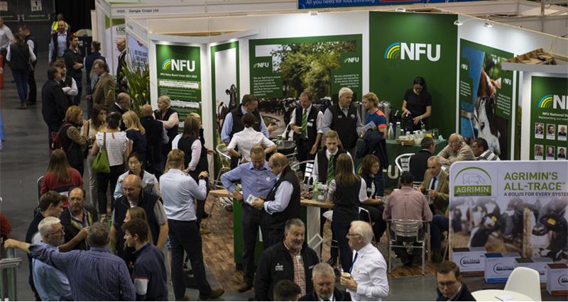 A picture of members talking to NFU advisers on a busy NFU stand at UK Dairy Day 2022