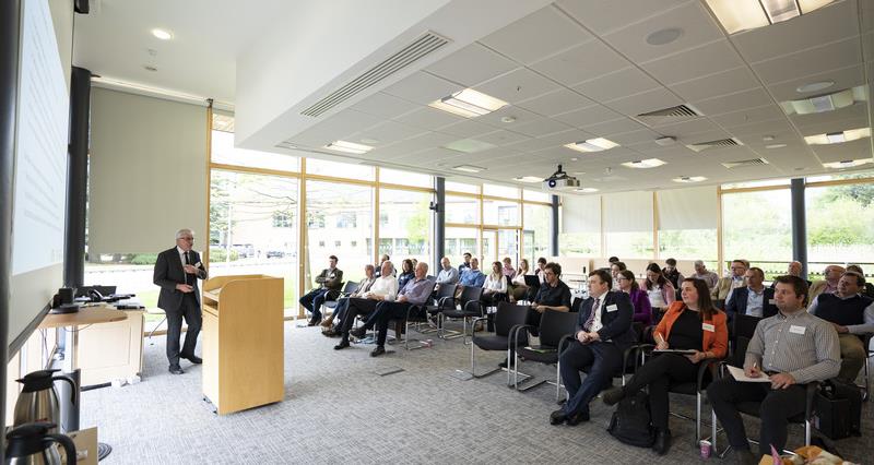 A photo of Gordon Hickman from Defra speaking to the audience at the NFU Poultry Research Seminar 2023 at NFU headquarters.