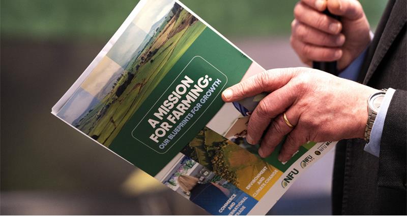 Man holding the NFU's blueprints for growth