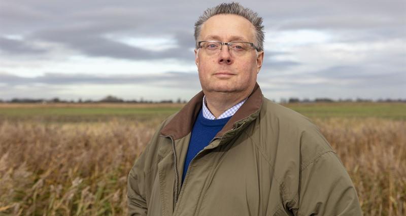 An image of Michael Sly stood in a field of unharvested sugar beet crop