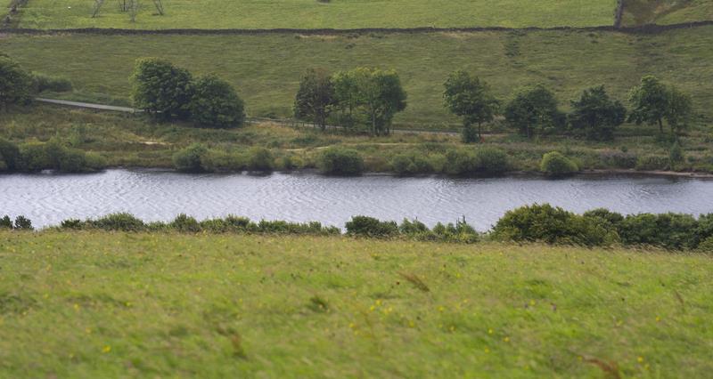 Farming landscape with a river running through it