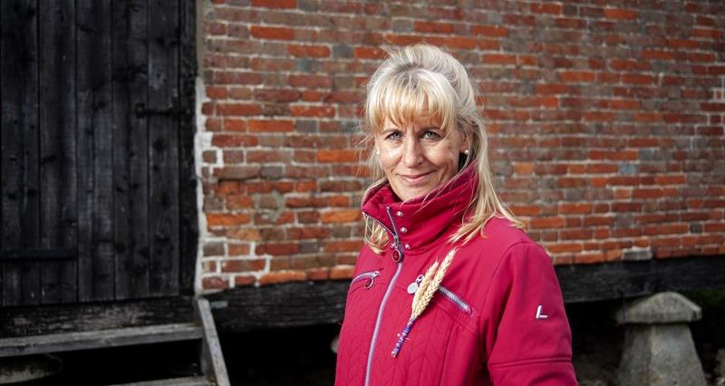 An image of NFU President Minette Batters stood against a brick wall