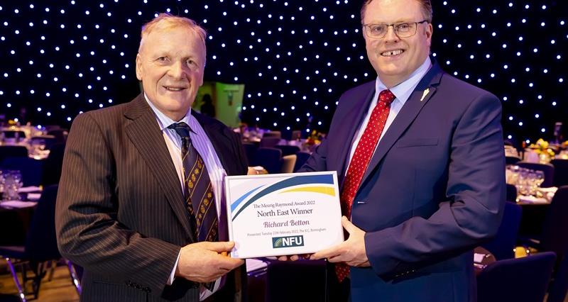Richard Betton receiving his award from NFU Director General, Terry Jones