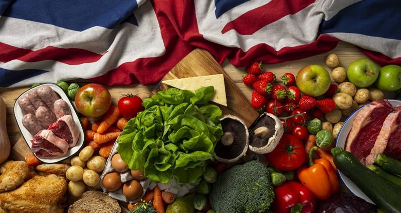 An image of a British flag surrounded by great British food.