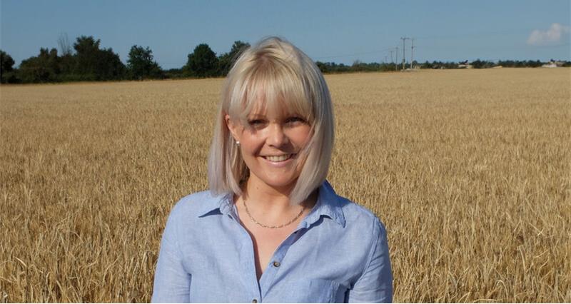 Heather Oldfield in a field of wheat