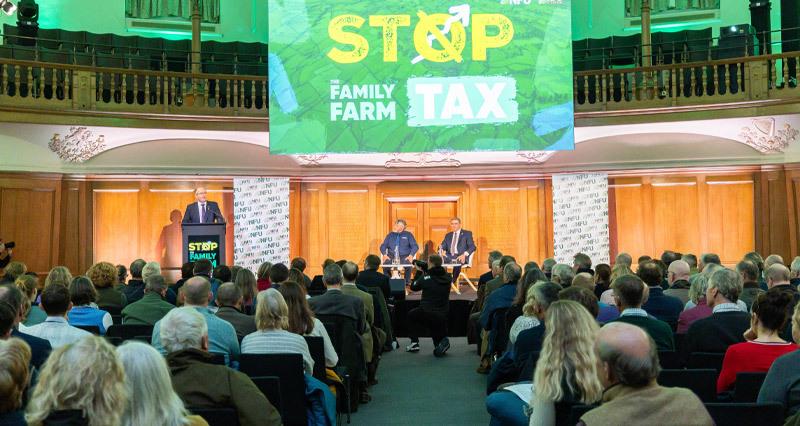 Tom delivering his speech to an audience of farmers