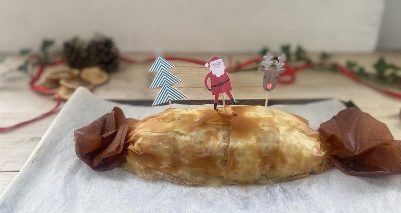 Filo pastry cracker filled with apple, sausage-meat and walnut stuffing with a Father Christmas on top