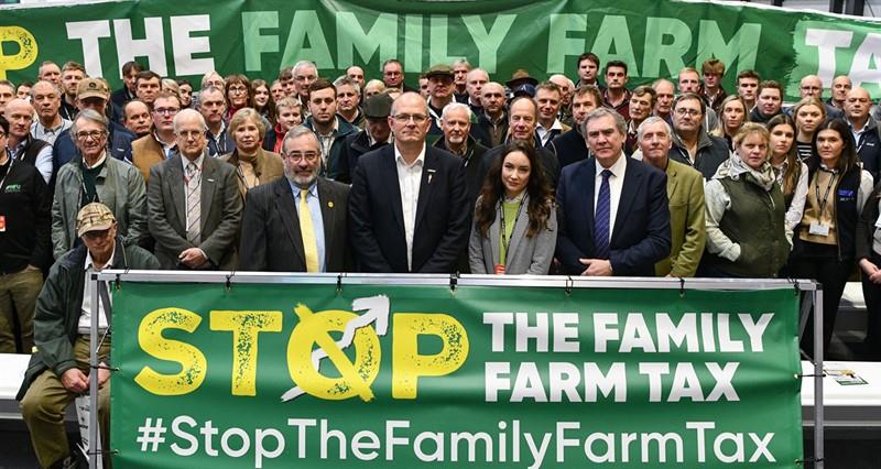 Tom Bradshaw and Aled Jones stood with a crowd of allied industries representatives who pledge to stop the family farm tax