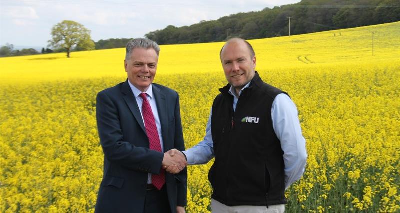 Richard Butler and Robert Newbery out on farm 
