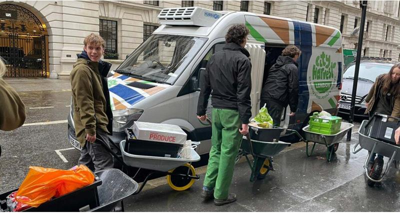 Farmers loading food into a City Harvest van