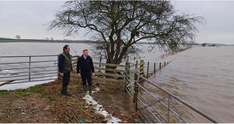 Nigel Watson and Robbie Moore on a flooded farm