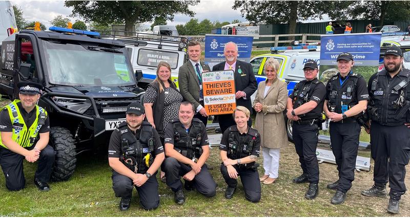 An image of the East Yorkshire rural task force and NFU President Minette Batters gathered in front of an ATV holding a sign saying 'thieves beware'