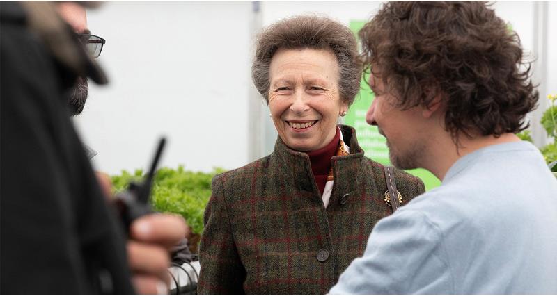 HRH Princess Anne smiling on a farm