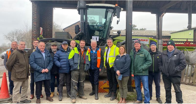An image of Olly Harrison with the Metro Mayor of Liverpool and NFU representatives stood in front of a tractor
