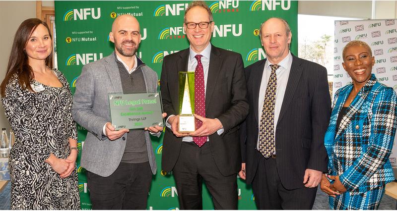 Law firm Thrings holding an award