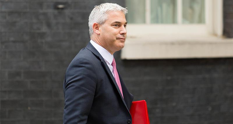 Steve Barclay carrying a red folder