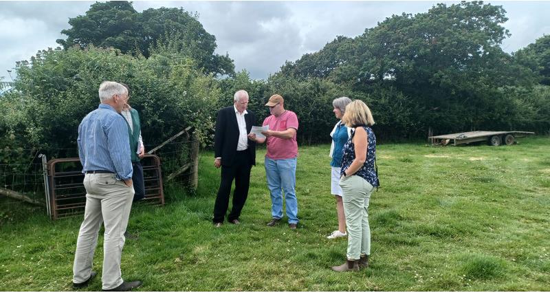 Farmer Philip Bond, Minister Daniel Zeichner, NFU branch chair, Richard Tucker and his wife Marilyn and Cathy Case, Devon NFU Vice Chair stood in a field