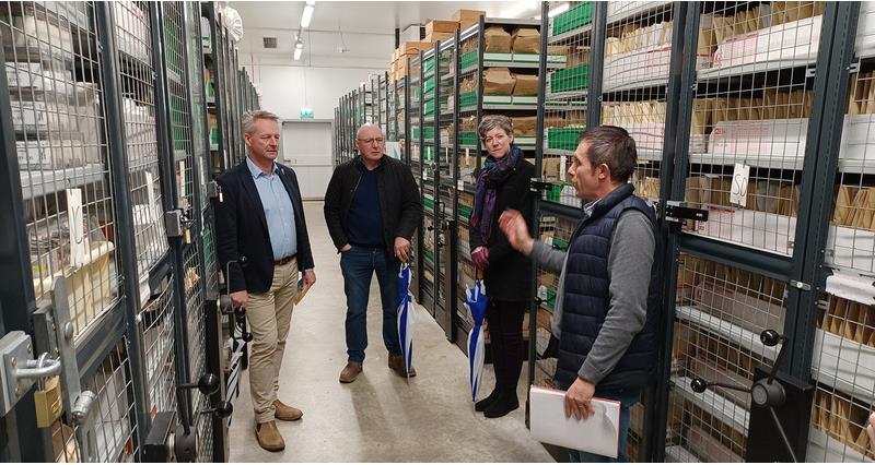 An image of David Exwood and NFU Chief Science and Regulatory Affairs Adviser Helen Ferrier being shown around a warehouse
