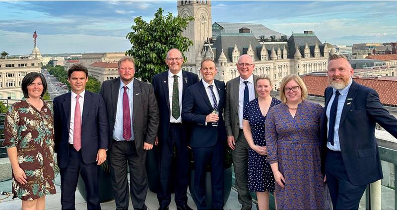 NFU representatives standing on on a balcony in the US