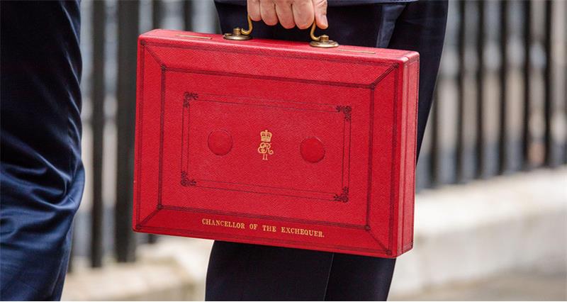 Photo of the red budget box being carried on Downing Street