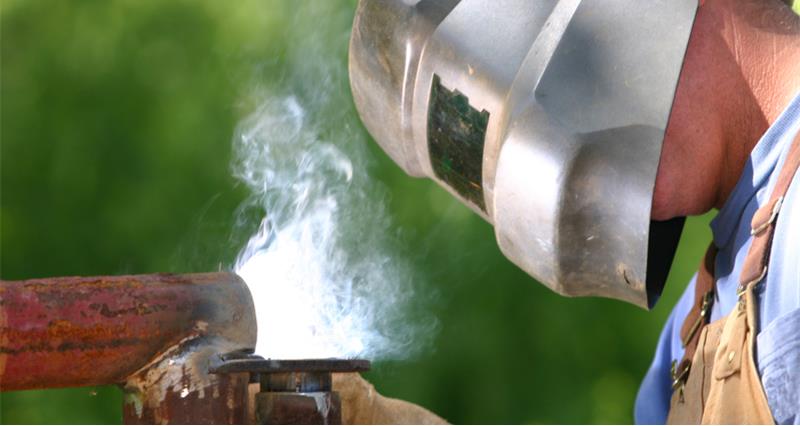 An image of a person welding and wearing a mask
