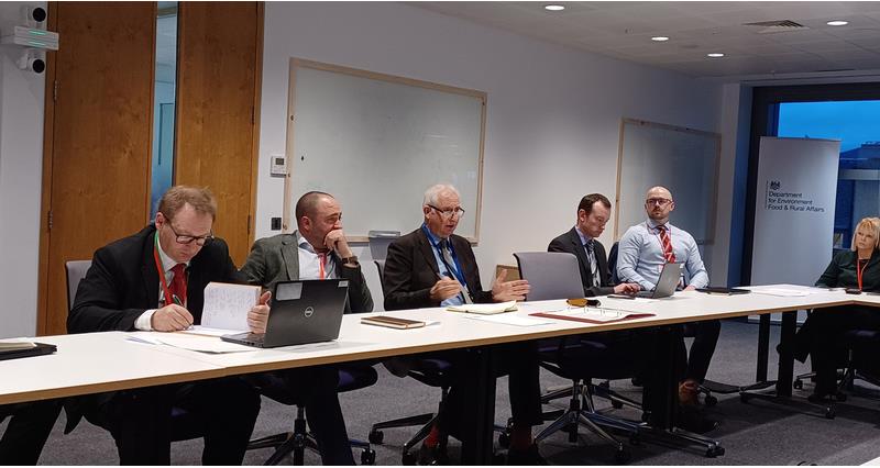 Jamie Burrows and Daniel Zeichner in a crops board meeting