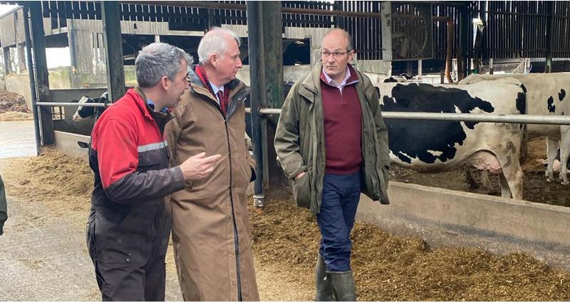 Tom Bradshaw speaking to Daniel Zeichner on a farm